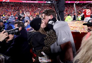 Taylor-and-Travis-Kiss-GettyImages-2196123517