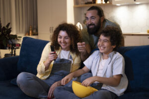 close-up-child-watching-movies-with-parents-1024x683-1