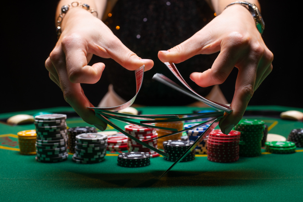girl-croupier-shuffles-poker-cards-casino