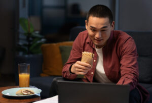 medium-shot-man-with-paper-wrapped-sandwich-1024x698-1