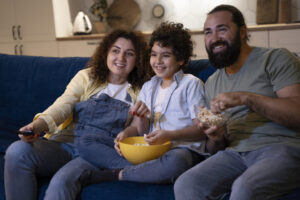 close-up-child-watching-movies-with-parents-1024x683-1