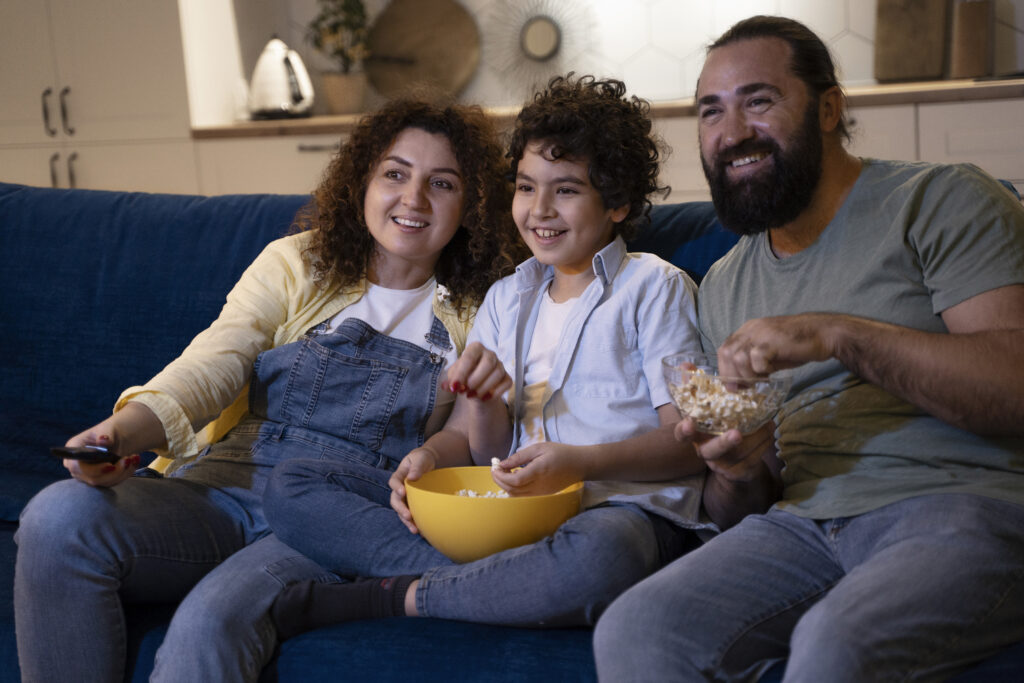 close-up-child-watching-movies-with-parents-1024x683-1