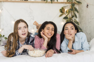 females-lying-bed-watching-tv-1024x683-1