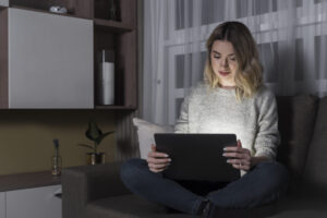 front-view-woman-working-laptop-1024x684-1