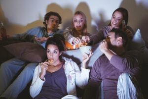 group-five-friends-watching-movie-1024x683-1