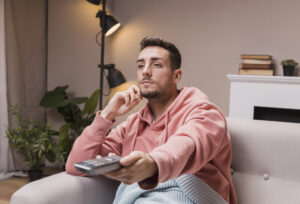 high-angle-young-man-holding-remote-1024x698-1