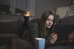 woman-watching-movie-couch-1024x683-1