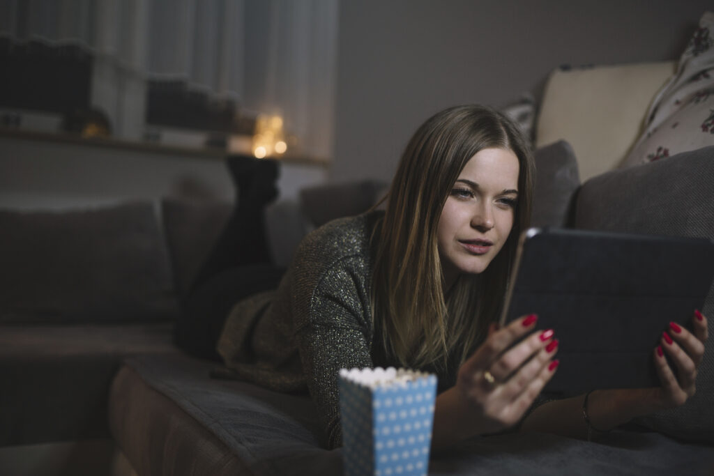 woman-watching-movie-couch-1024x683-1