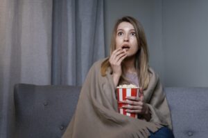 woman-watching-tv-eating-popcorn-1024x683-1